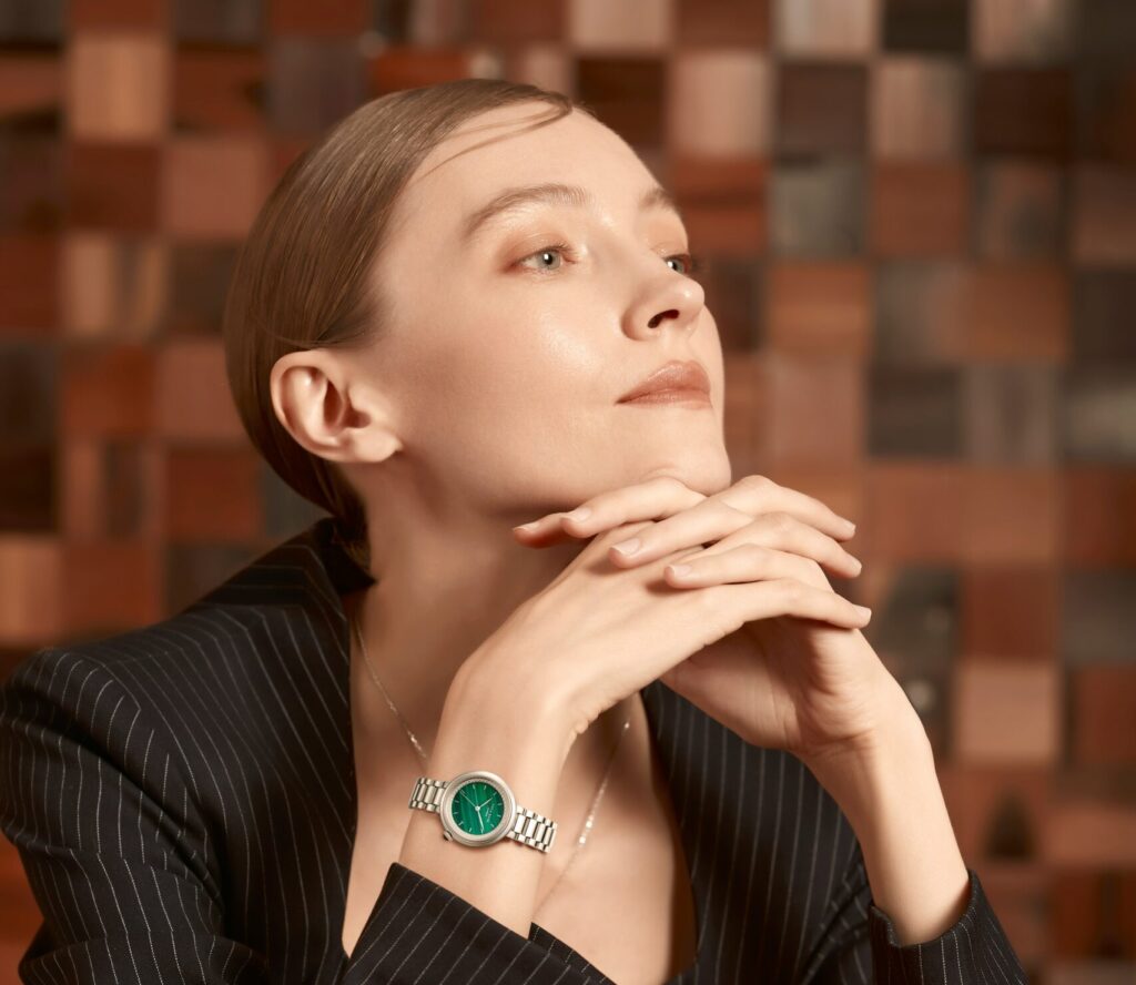 woman wearing minimalist wristwatch