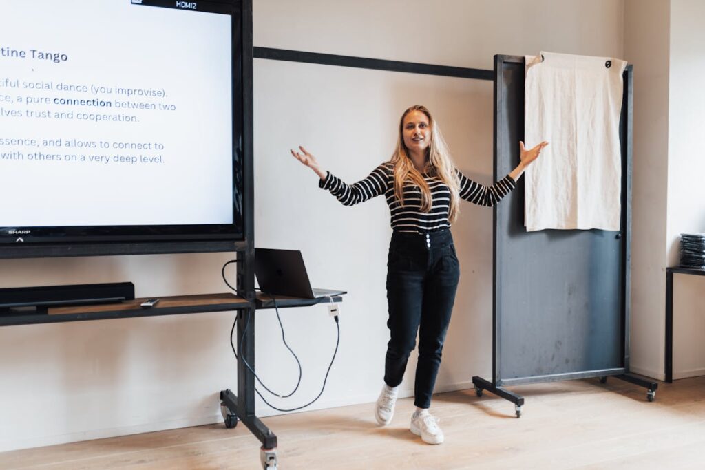 Blonde Woman Presenting in Meeting