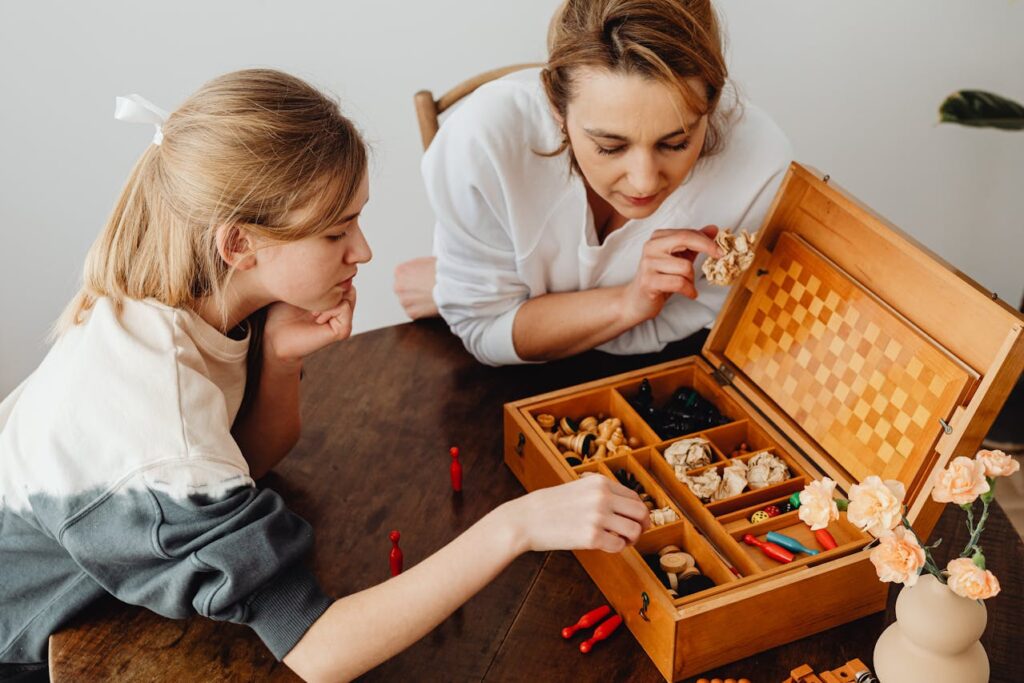 Mother and Daughter Playing Game on Table