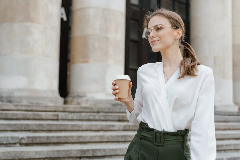 Woman in White Dress Shirt Holding White Ceramic Mug