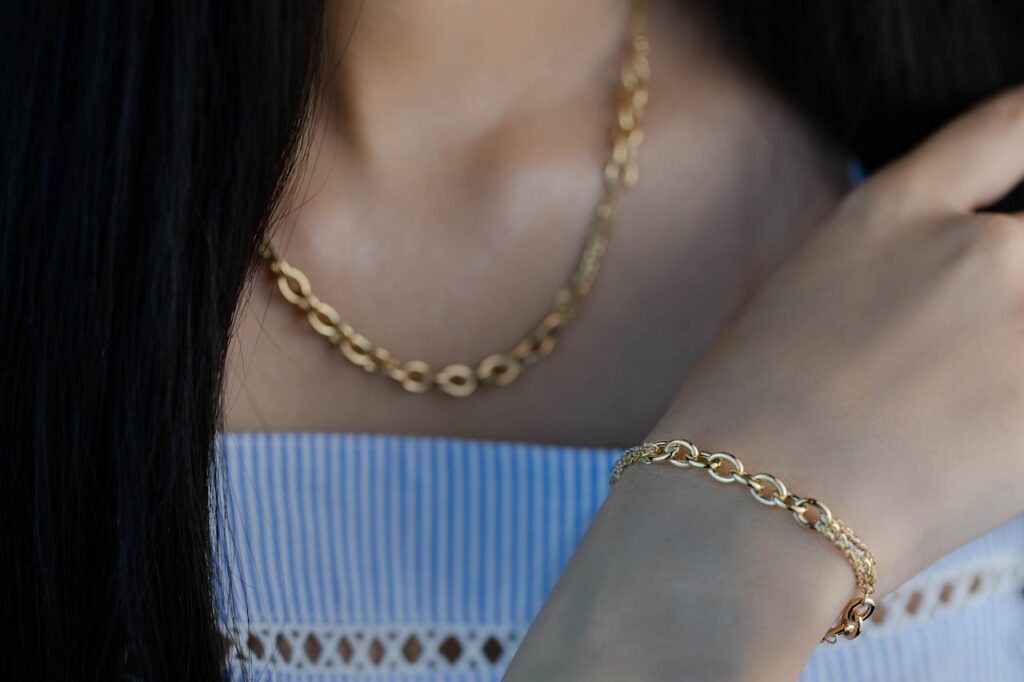 Woman with Golden Necklace and Bracelet