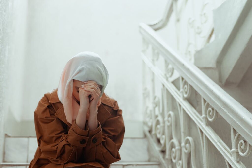 Woman Crying on Stairs