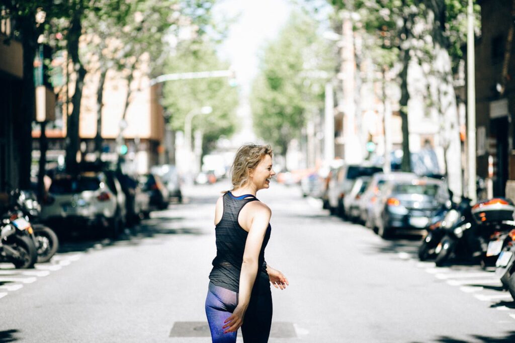 Woman Walking in the Middle of the Street