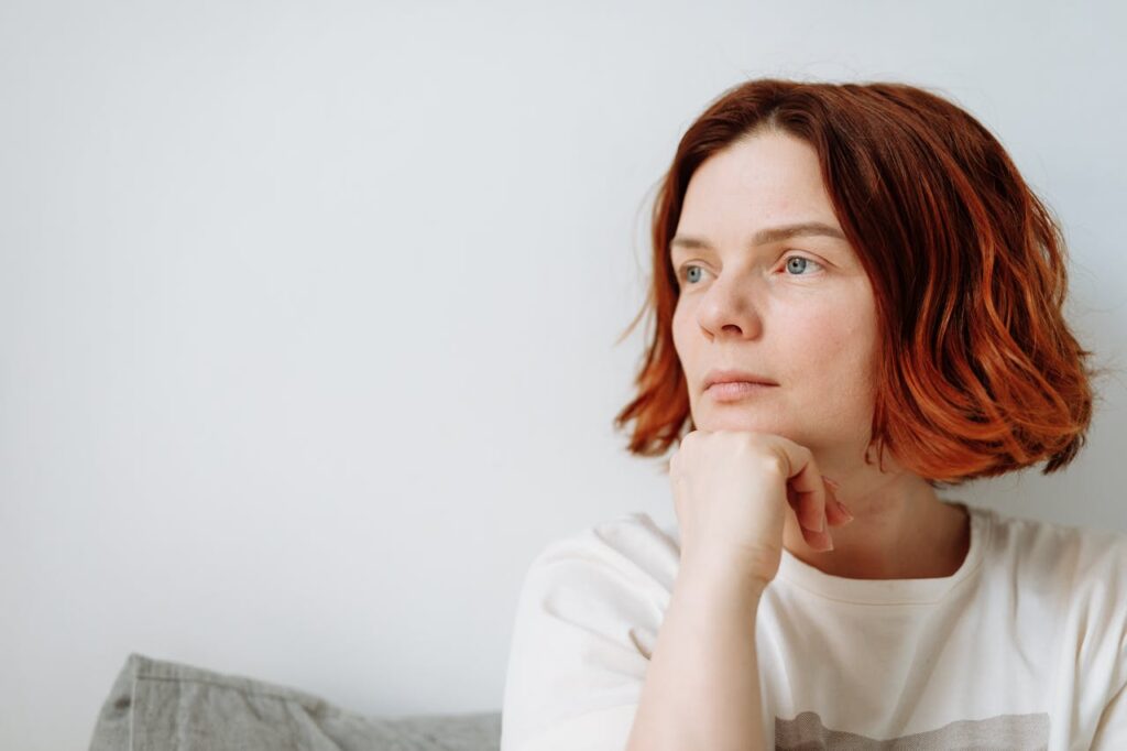 Young Woman Sitting and Thinking