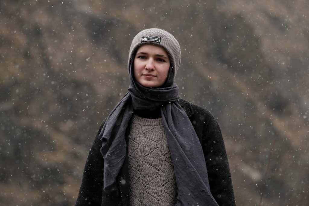 Woman in Hat and Scarf in Rain