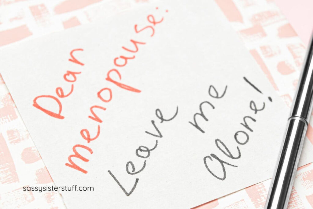 a top view of a note that says dear menopause leave me alone.