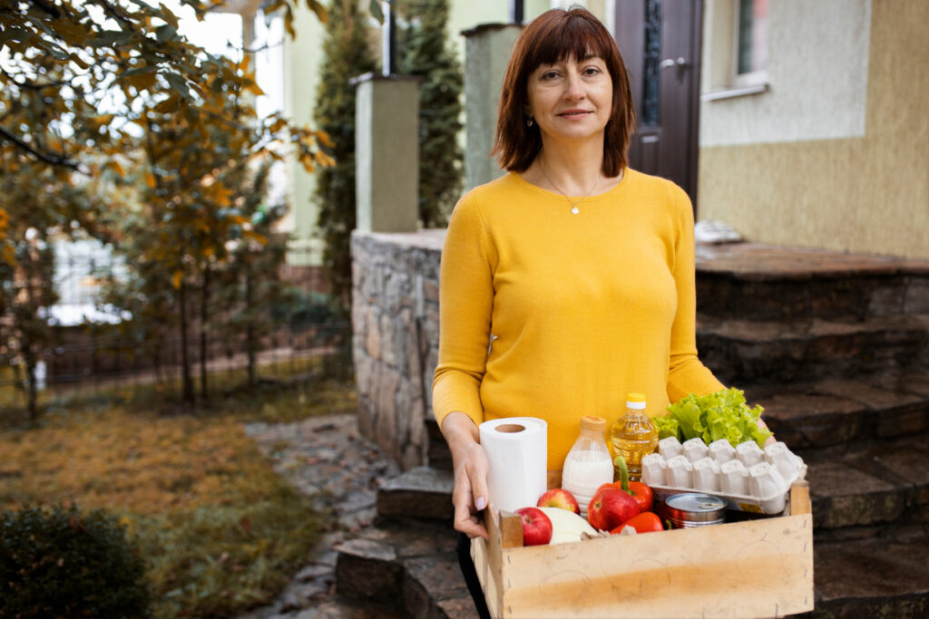women walking with groceries
