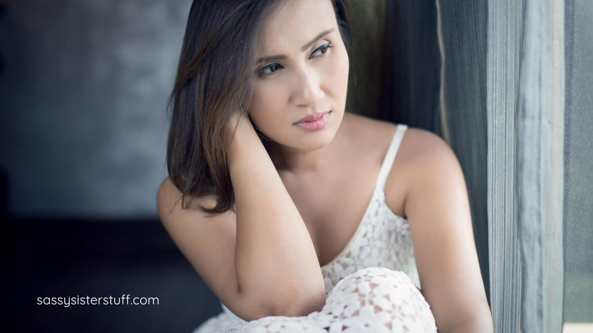 middle aged woman contemplating how to stop feeling guilty for putting yourself first.