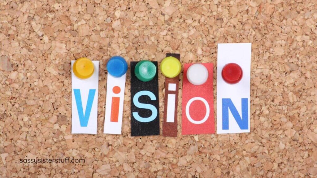 VISION tacked onto a cork board.