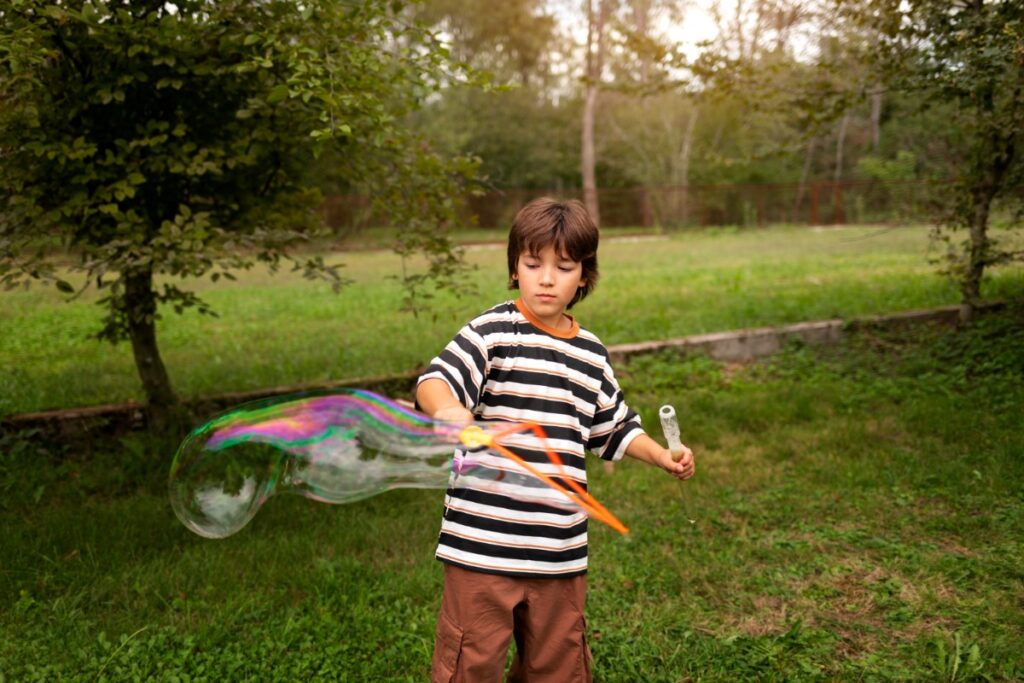 Blowing bubbles and chasing them