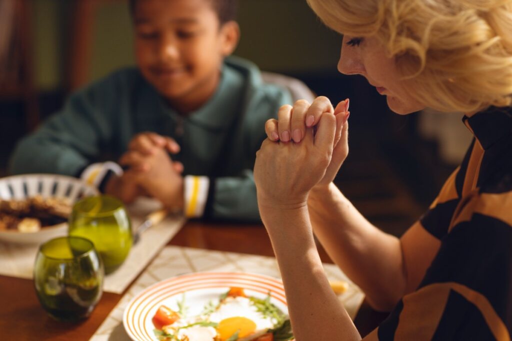 Insisting on saying grace before every meal