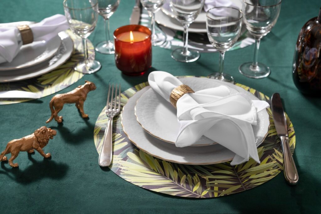 Using monogrammed linen napkins at meals