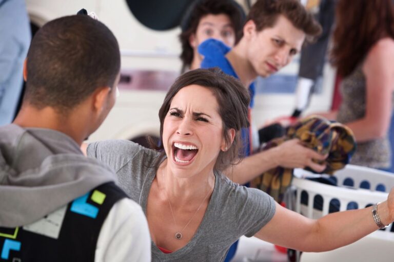 woman hands in the air yelling at someone
