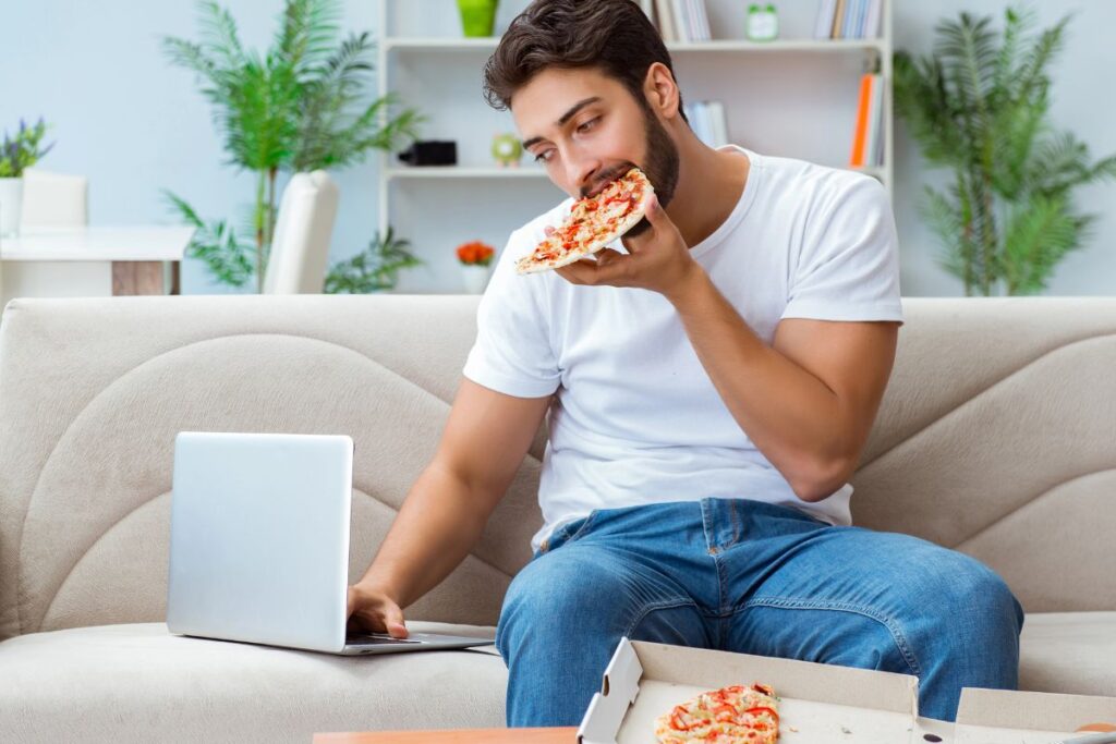 working while eating pizza on the couch
