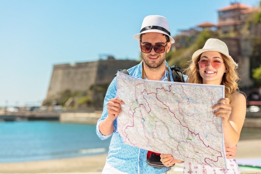 Constantly looking at maps or phones on the street