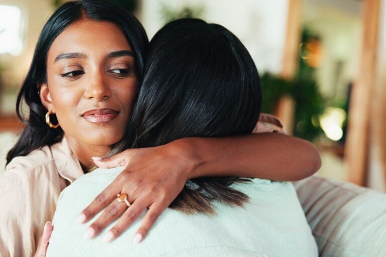 Fake friend hugging looking sideways