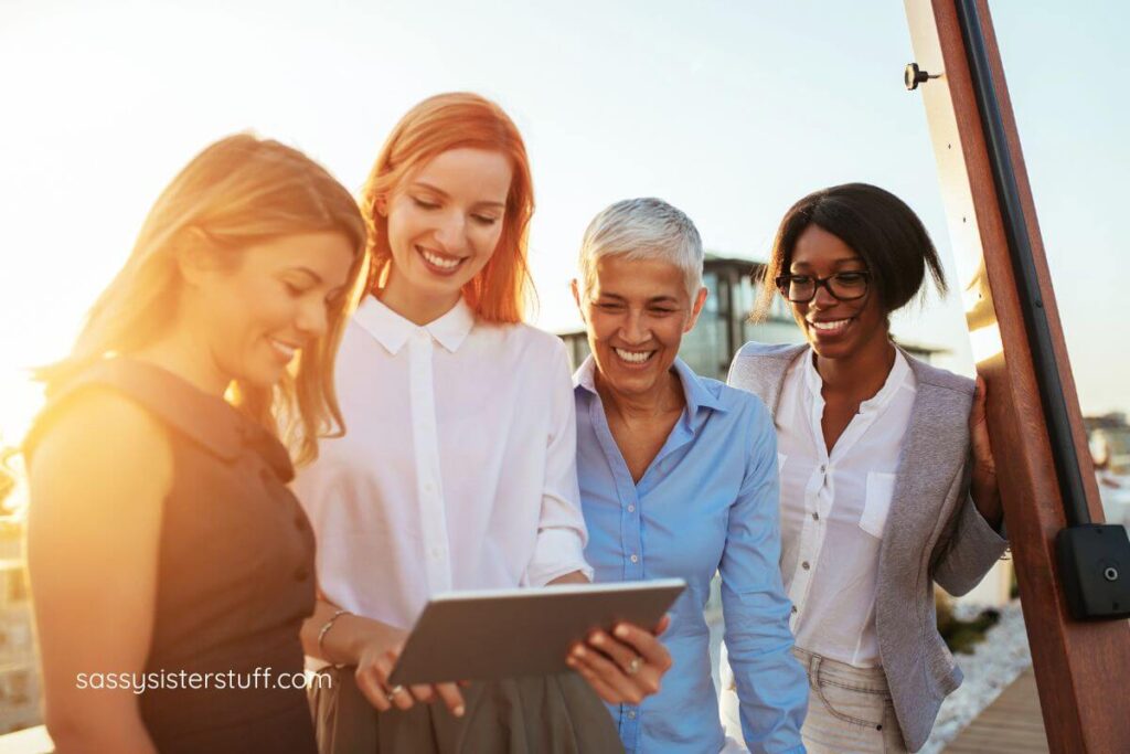 a group of four mixed-age women gather outside to research how to do a life audit.