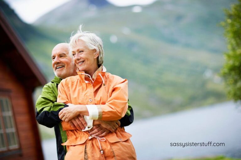 a happy senior couple spend time in the mountains enjoying life.