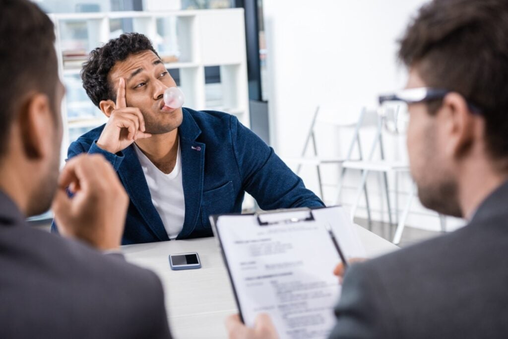 Popping gum loudly during meetings
