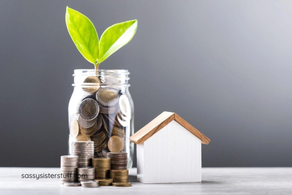 a jar of coins with a plant beginning to grow out the top and a small house sitting next to the jar representing how to prepare for responsible homeownership.