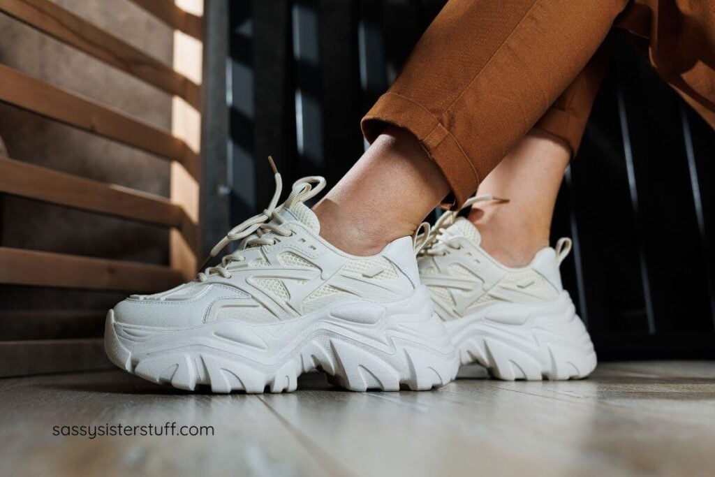 close up of female feet with white supportive footwear on.