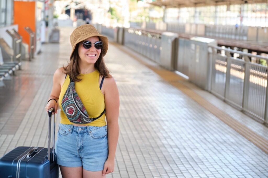 Wearing a fanny pack loaded with travel gear