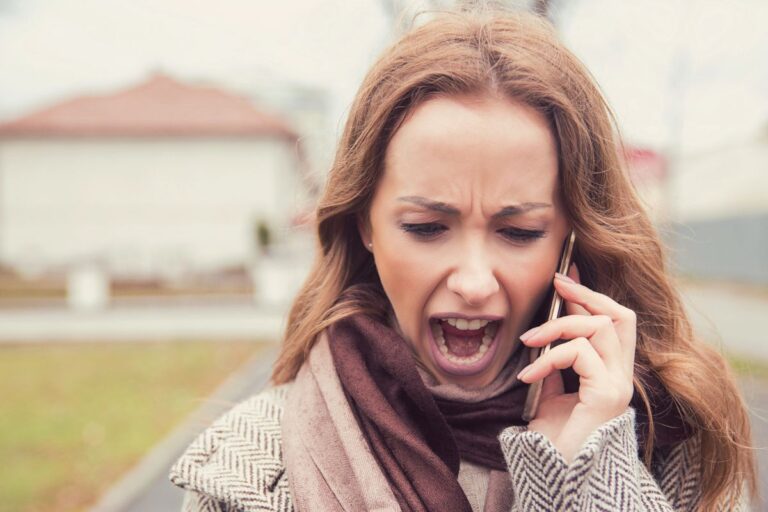 woman screaming into a phone