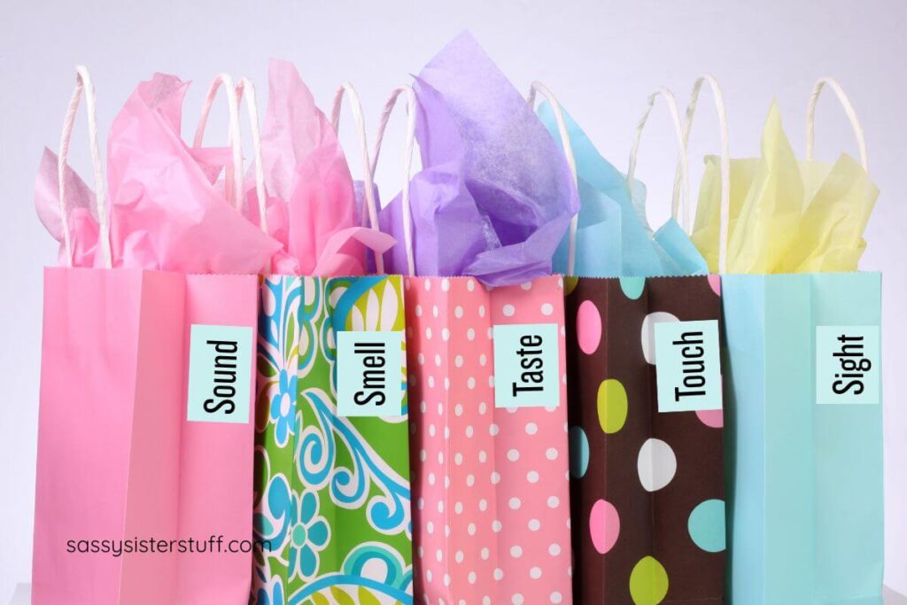 5 senses gift ideas in labeled bags.
