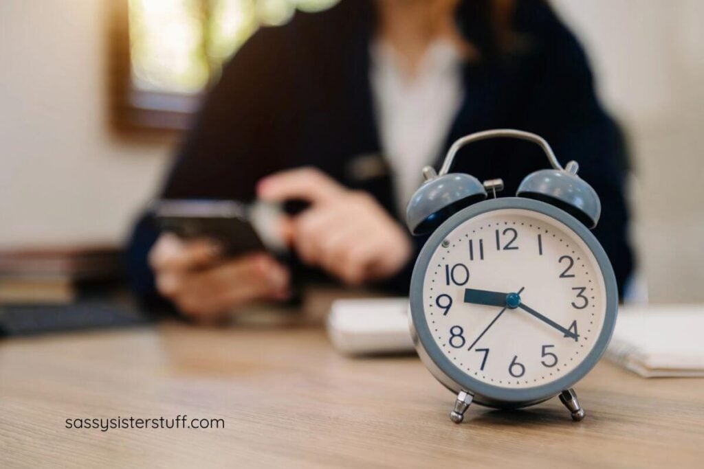 close up of an alarm clock that will help the person sitting at the desk be more productive every day by staying on time.