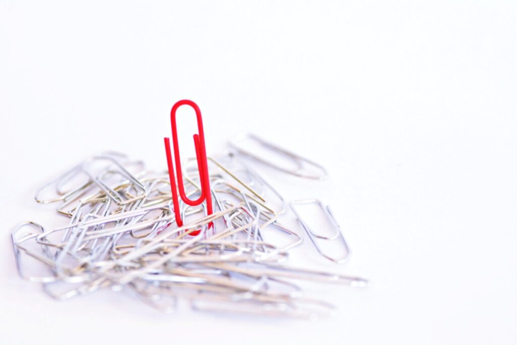 Bent paper clips shaped like abstract art