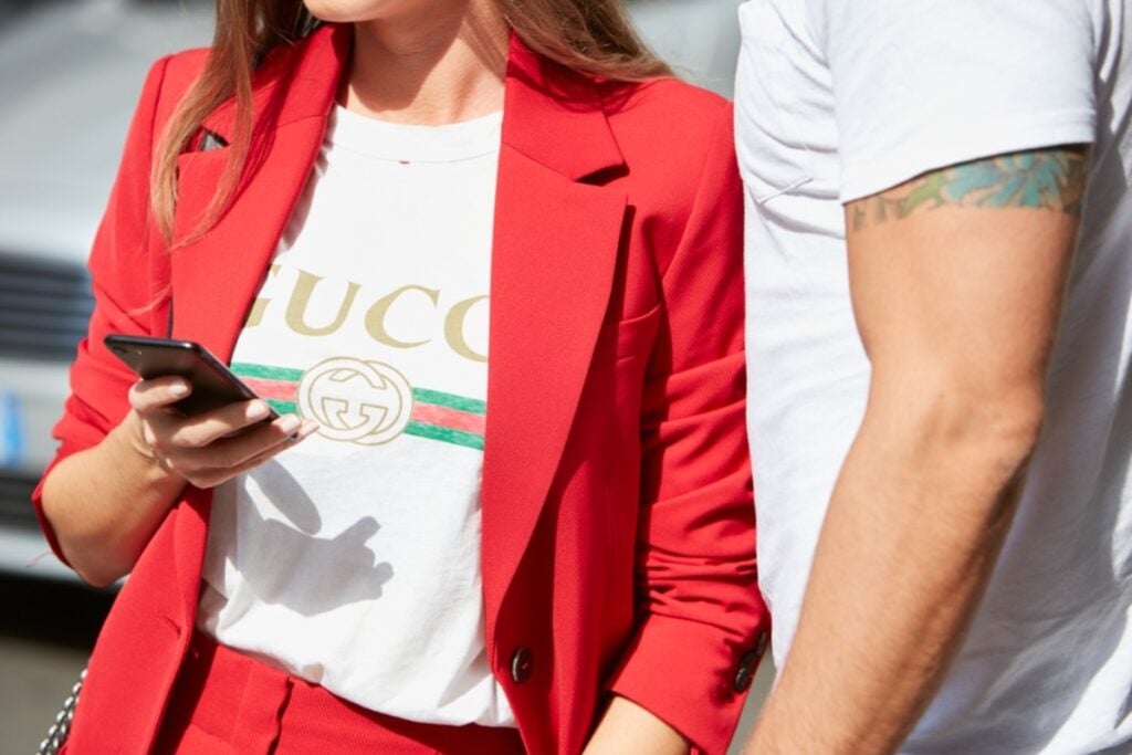 Buying brand-name clothes to display status