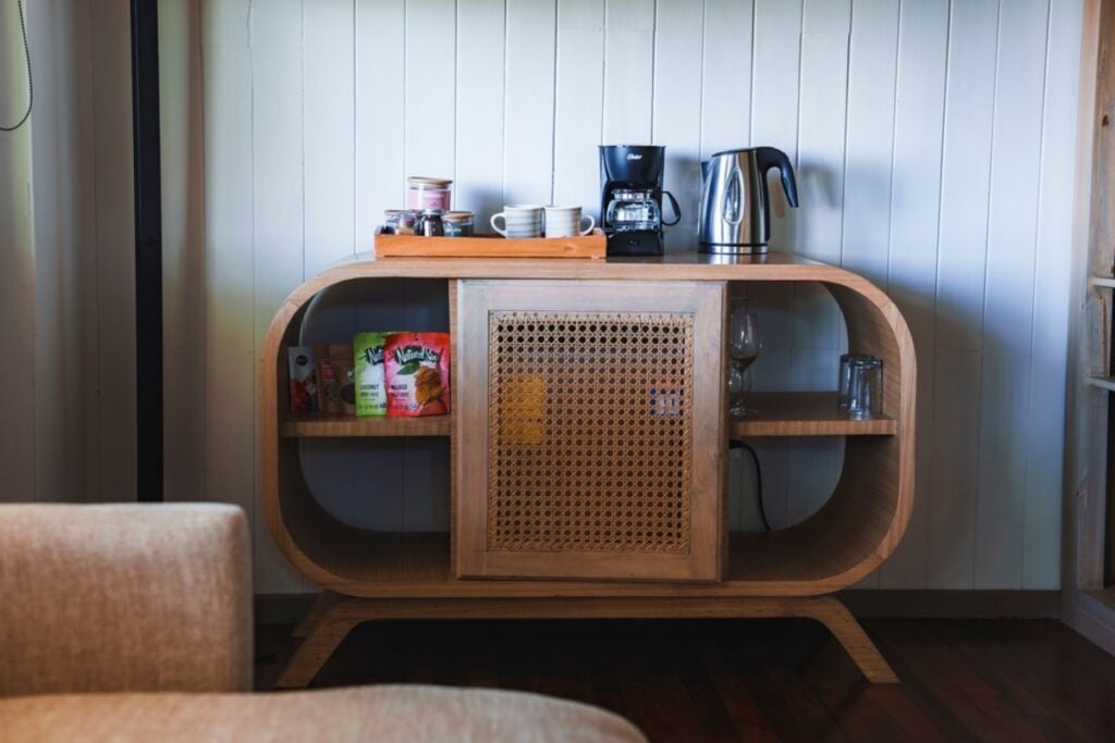 Eating snacks straight from the mini bar