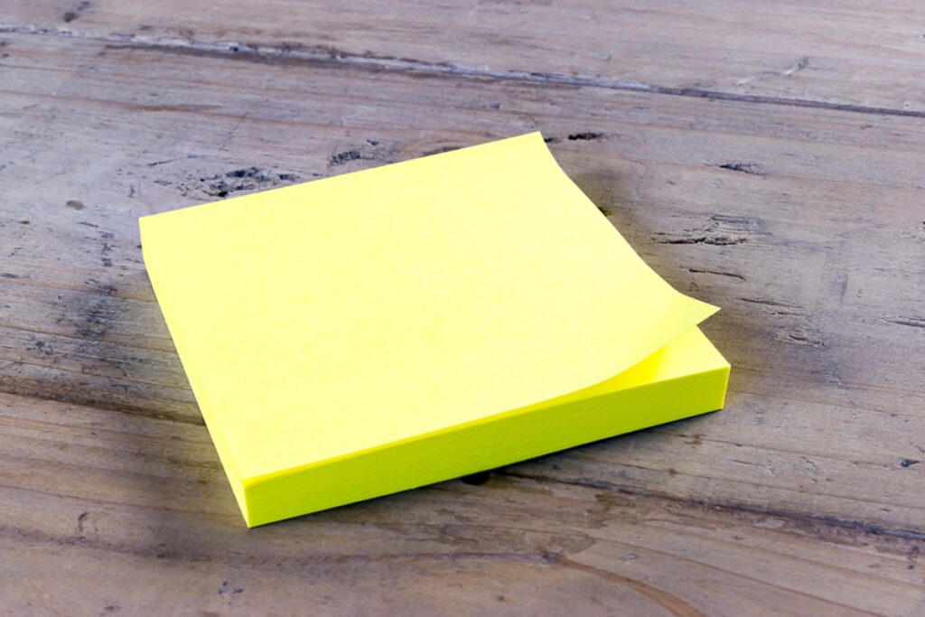 Half-used sticky note pads
