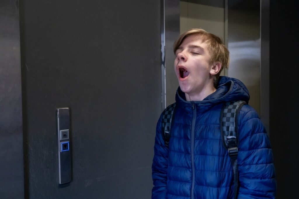 Making exaggerated yawns