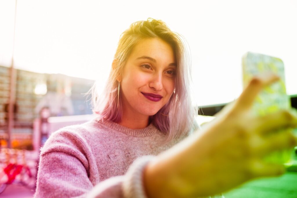 Overusing heavy photo filters on selfies