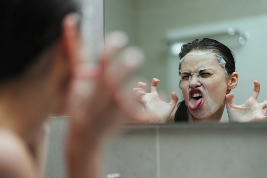 Practicing silly faces in the mirror