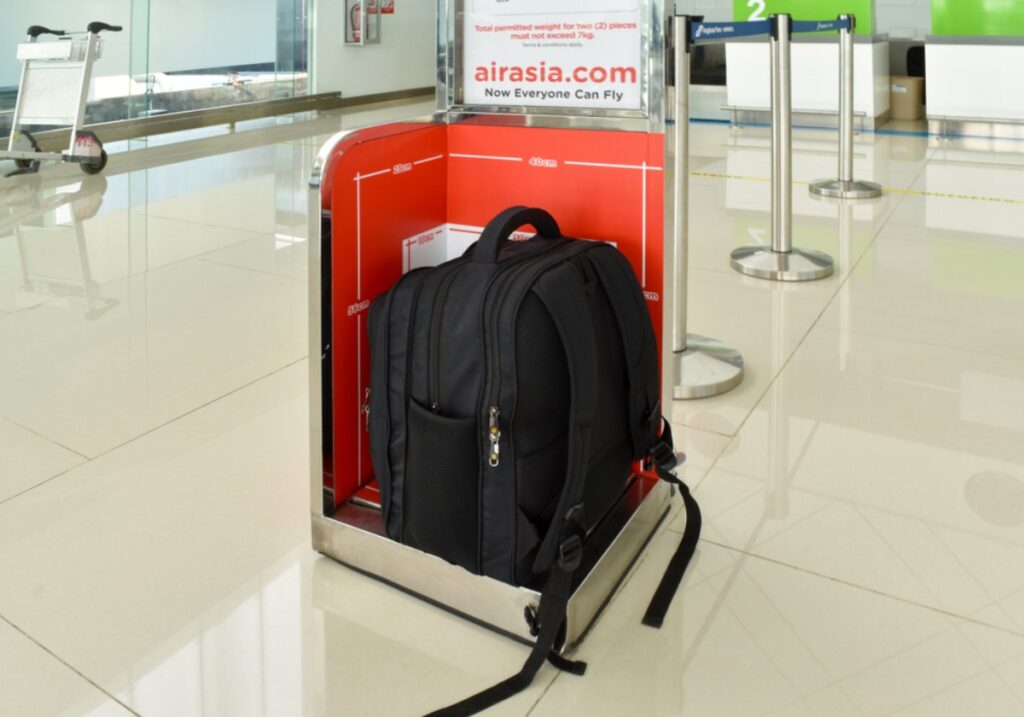 Rearranging carry-on items meticulously