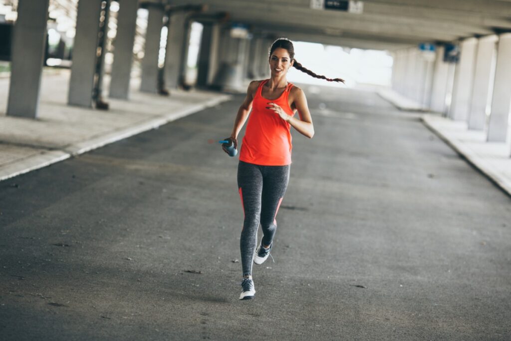 Someone jogging between parked cars