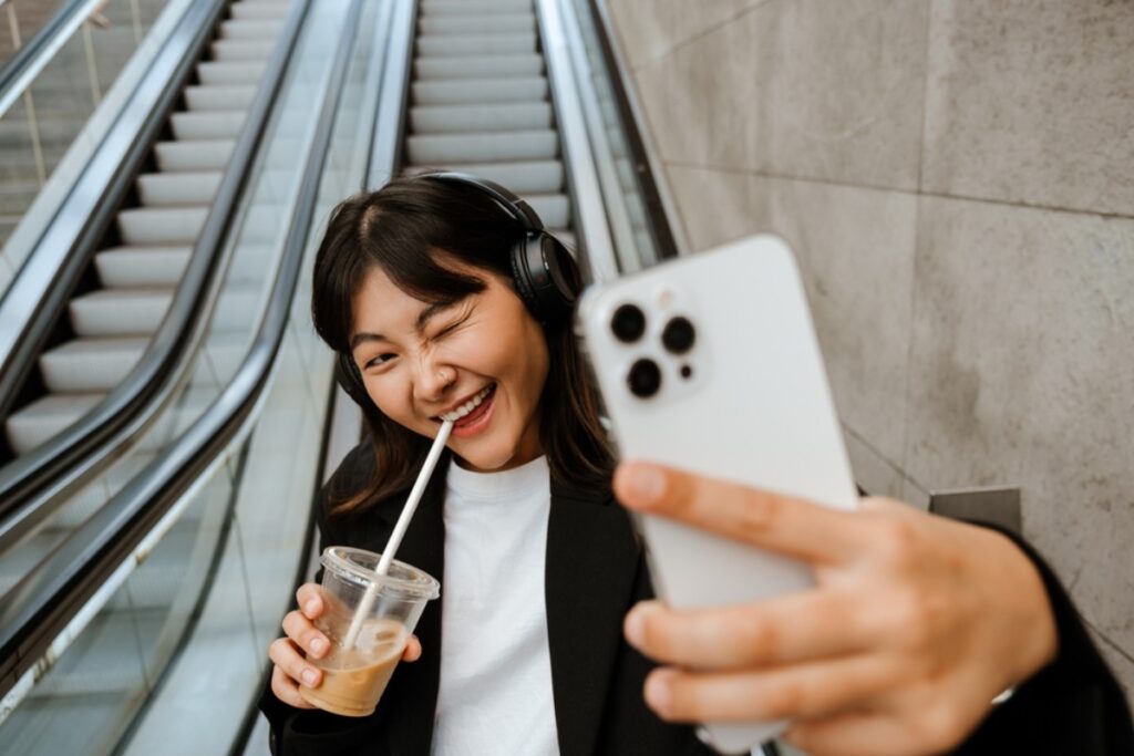Taking escalator selfies with exaggerated surprised faces