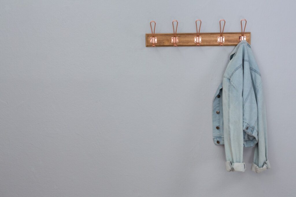 The frantic quest for the tiny hook to hang your clothes without causing a mini avalanche