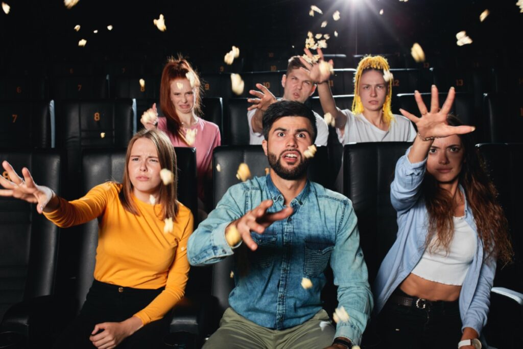 Throwing popcorn or snacks at others