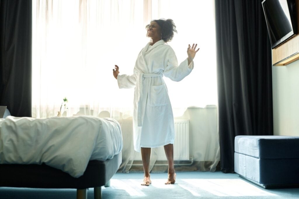 Trying on bathrobes like a fashion show