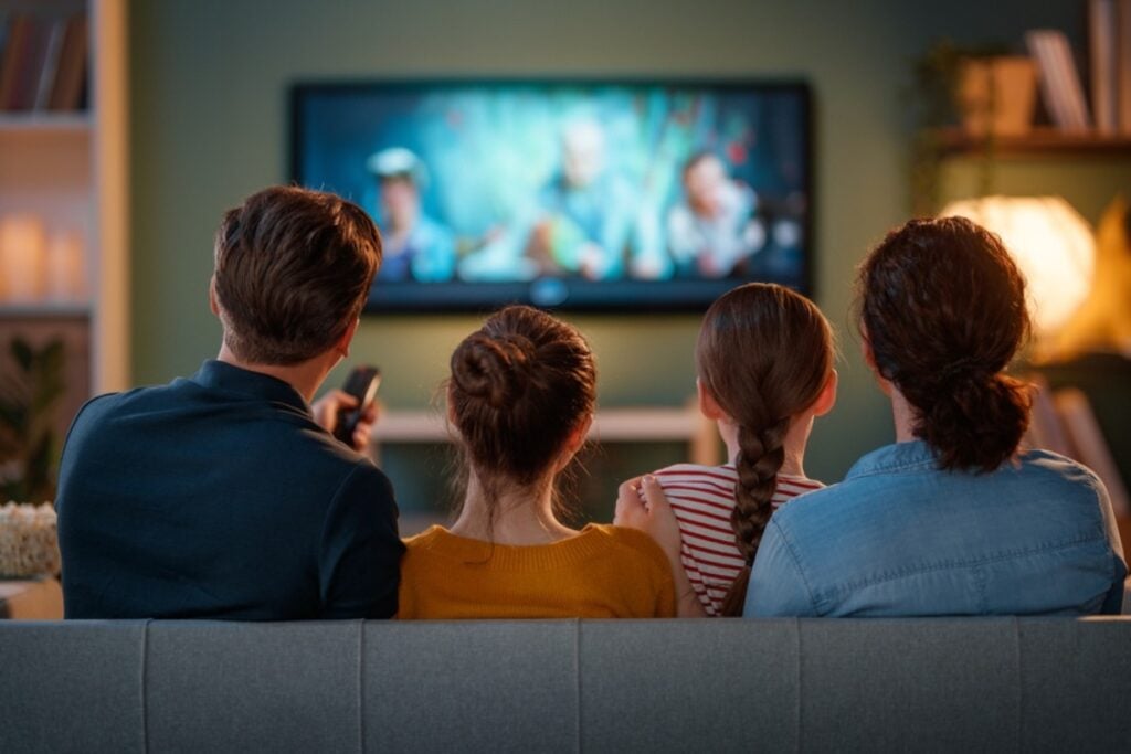 Weekly family movie night with themed snacks