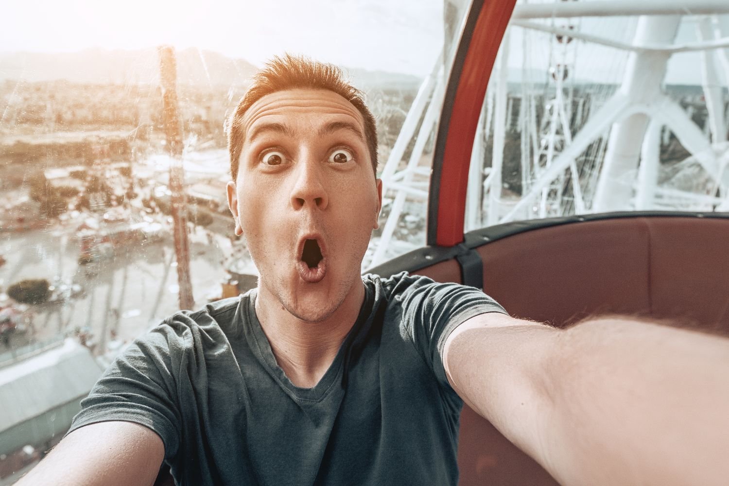 man excited on a ferris wheel