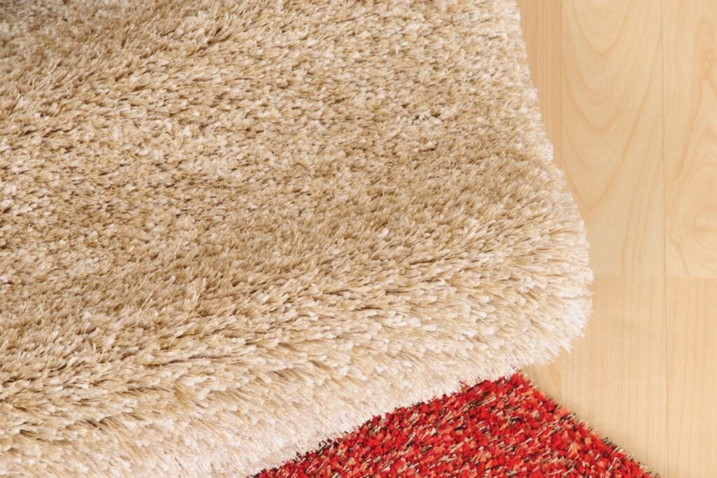 Add soft area rugs to make hardwood floors feel warm and inviting