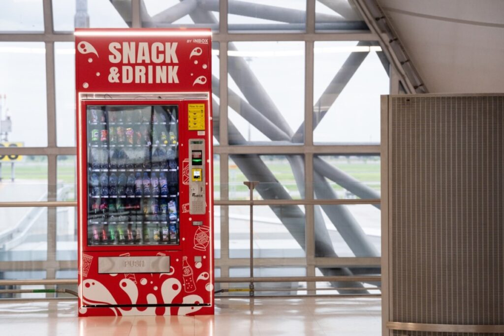 Judging the snack selection in the vending machine like a food critic