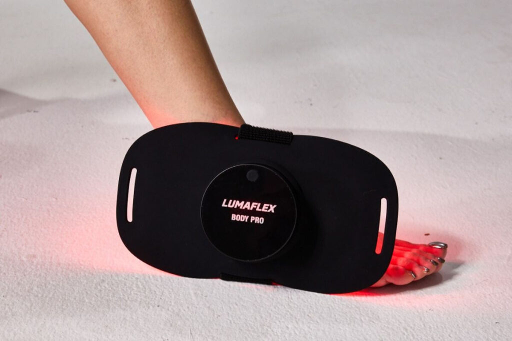 Lumaflex red light device on a female's foot.