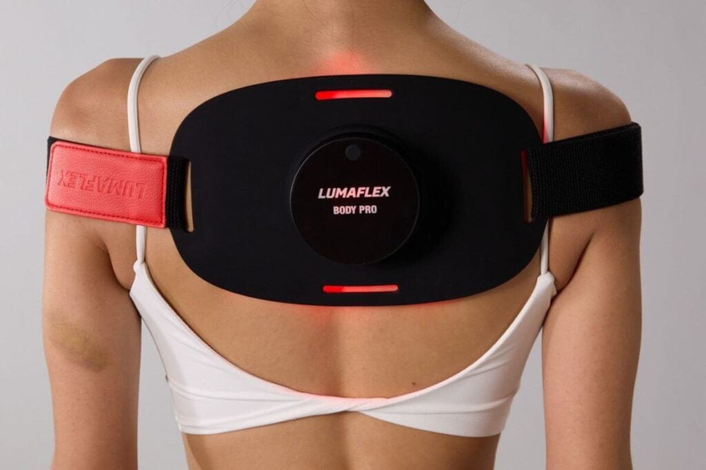 Lumaflex body pro red light device on a female's upper back.