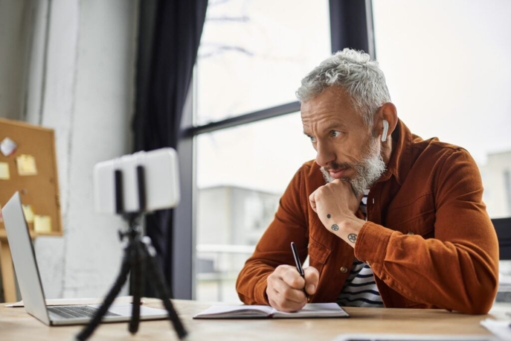 Pretending to take notes but actually doodling funny cartoons