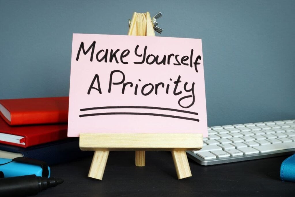 a desktop sign that says Make Yourself a Priority.